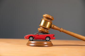 Judge gavel and car model
