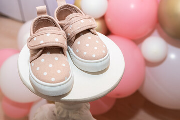 Children's shoes for girls, coasters on a pink background. close up top view, side view. the concept of children's clothing