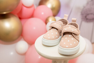 Children's shoes for girls, coasters on a pink background. close up top view, side view. the concept of children's clothing