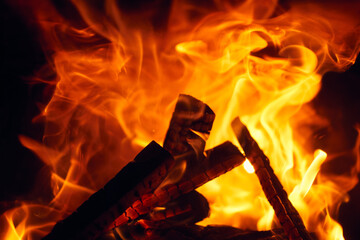 A fire burns in a fireplace, Fire to keep warm. Logs burning in