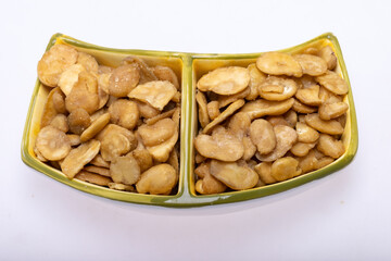 Roasted and salted fava beans for a healthy vegan and vegetarian diet snack. High in protein,...