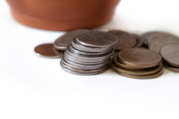 saving time Clay piggy bank pot coin in indian currency on white background indian money coins