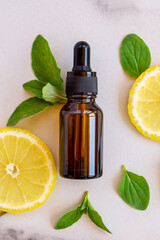 Dark glass bottle with Citrus fruit essential oil, vitamin c serum, beauty care aroma therapy