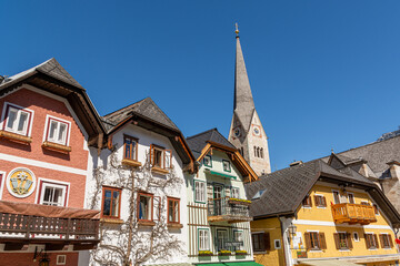 Hallstatt, Austria - March 31, 2021: Church in Hallstatt seen from the market place