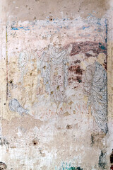 remains of drawings on the walls of a destroyed Orthodox church
