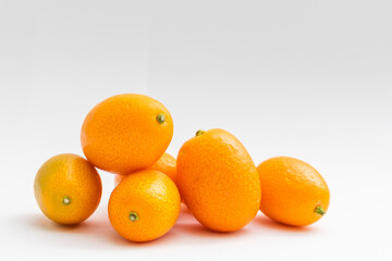 kumquat on white background. exotic fruits