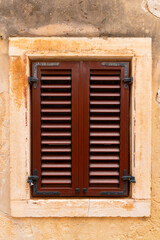 Facade window of an old European Mediterranean town. Close-up. Texture.