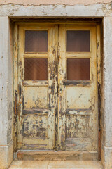 Facade door of an old European Mediterranean town. Close-up. Texture.