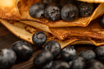 Fresh blueberries and traditional Russian pancakes. Shrovetide week of the end of winter.