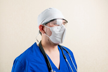 Fototapeta na wymiar Doctor in blue uniform and medical mask.