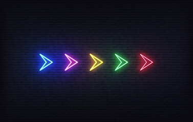 Neon futuristic arrow sign. Set of colorful glowing neon arrow pointer on brick wall background