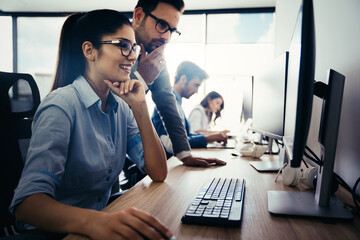Creative people working in office on computer