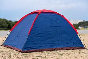 Blue and red camping tent.