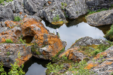 A Lonley Person Standing on a Rock