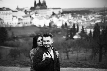 Loving young couple walking around Prague, Czech Republic