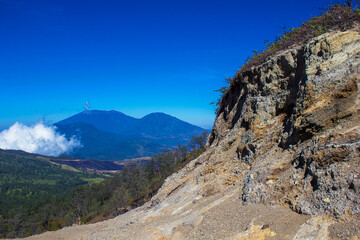 Mount Raung, one of the most active volcanoes on the island of Java, Indonesia and volcanic cone Suket.  View from the Kawah Ijen hiking trail 