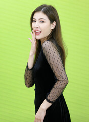 Portrait of Asian woman in black see through dress standking and pose with friendly positive smile face. Concept Beautiful and confident working woman.