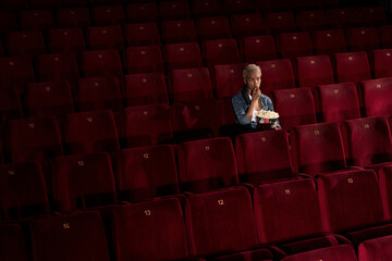 beautiful girl at the cinema alone