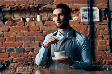 male waiter service a cup of coffee ordering professional