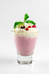 Isolated berry milkshake with whipped cream on the white background
