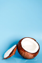 background with split coconuts close-up. coconuts and copy space. coconuts lay flat.