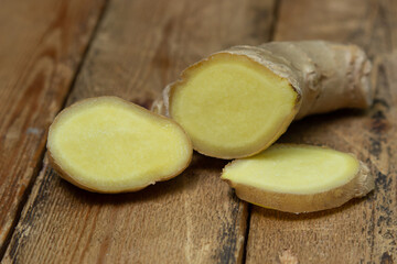Ginger on a wooden background. Chopped up ginger root. Healthy food