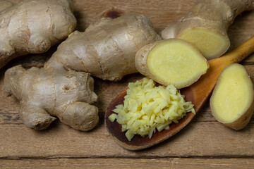 Ginger on a wooden background. Chopped ginger root. Healthy food. Healthy food concept