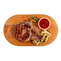 Isolated portion of grilled juicy steak with squash and sauce