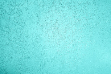 Plastered wall texture, light blue tone colored background