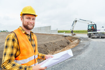 Construction workers with plan for the new bypass