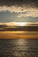 Naklejka na ściany i meble Sky at sunrise with sea and moody clouds