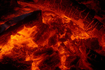 Close up view of the embers in a campfire or fireplace.