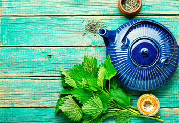 Herbal tea with nettle,wooden table