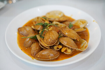 Stir-fried clams with roasted chili paste, Traditional Thai food recipe, Most popular dish in Thailand.