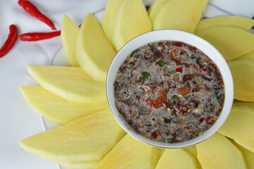 Green mango served with dipping sauce (sweet fish sauce spicy salad), Thai style dip.