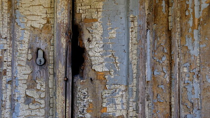 Cracked paint on an abandoned wooden house