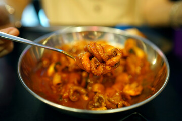 Spicy grilled baby octopus and grilled pork belly, Korean call Jukkumi gui.