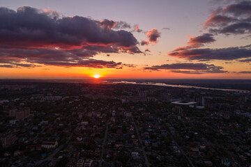 Fototapeta na wymiar Sunset or sunrise over the city. Drone photography over the city
