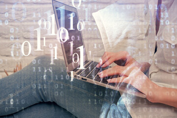 Fototapeta premium Double exposure of woman hands working on computer and data theme hologram drawing. Tech concept.