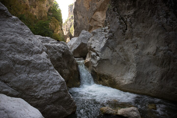 Inside a magnificent Gorge, with an impressive waterfall of 2 meters. At Venetikos river. Characterized by its high cliffs of 150-200 meters, Portitsa, Grevena, Greece.