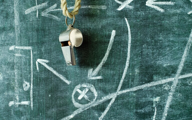 whistle of a soccer coach or referee and soccer tactics diagram on blackboard, great soccer event...