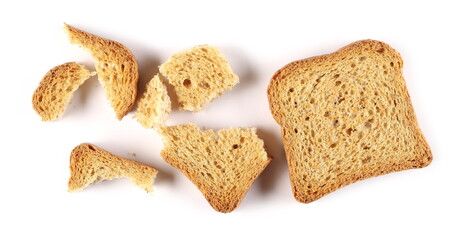 Wholemeal cracker, bread rusk, toast slice with crumbs isolated on white background, top view