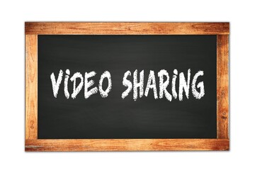 VIDEO  SHARING text written on wooden frame school blackboard.