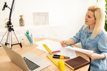 Architect working on blueprint. Architects workplace - architectural project, blueprints, ruler,...