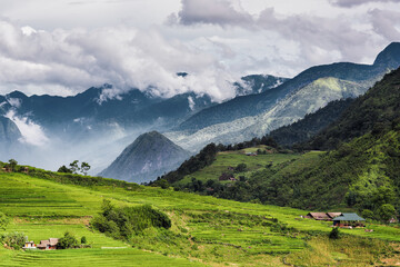 Fototapeta na wymiar Panorama Scenery View of Agriculture Rice Fields, Nature Landscape of Rice Terrace Field at Sapa, Vietnam. Panorama Countryside Valley Scenic With Mountain of Agricultural Farmland Background.