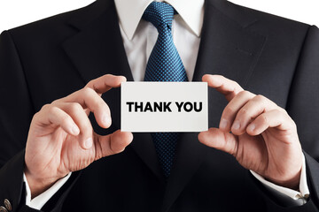 Businessman shows business card with the word thank you. Customer service gratitude