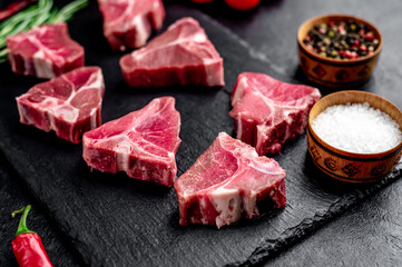 mini raw
Beef T-Bone steak on stone background