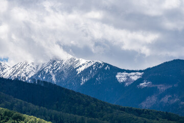 Fototapeta na wymiar White Clouds in Mountains