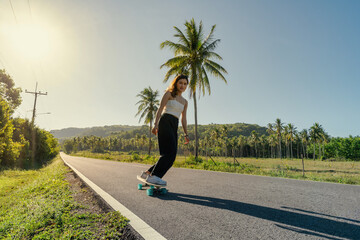 Yougn Asian Women Playing Surfskate on a road, in summer season - 433213250