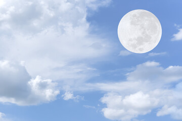 Naklejka na ściany i meble Full moon and white clouds on the sky.